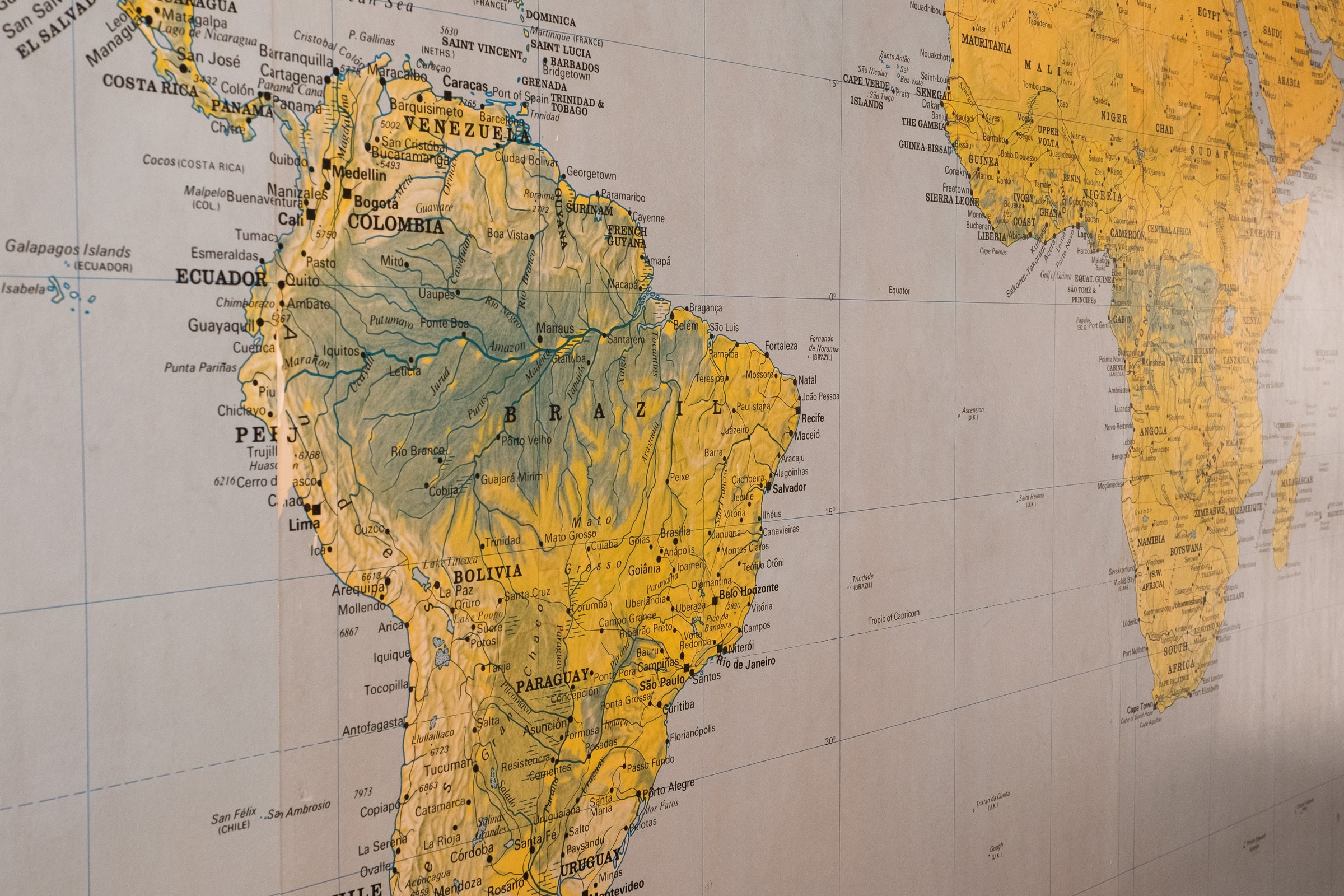 Close-up of a vintage-style map highlighting South America and parts of Africa.