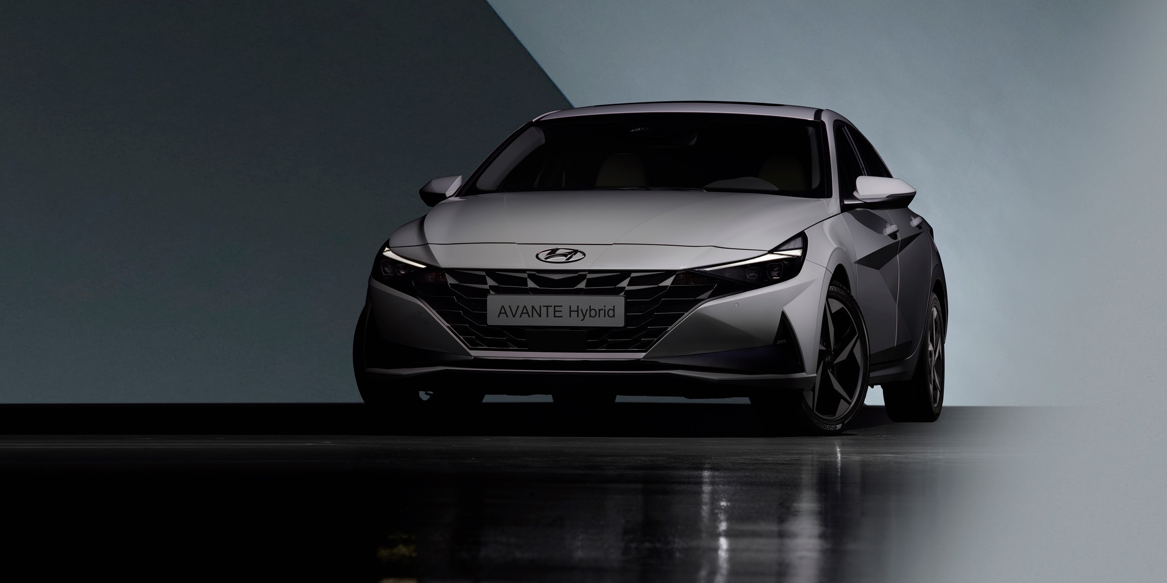 Sleek and modern Hyundai Avante Hybrid sedan displayed in a studio setting.